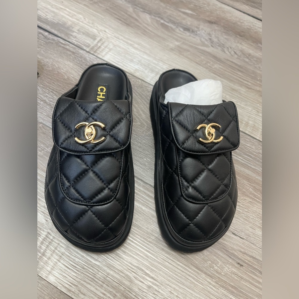 CHANEL turn lock mules